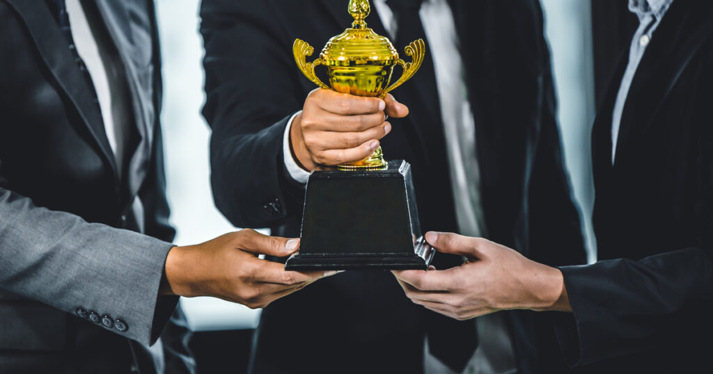 Business team reaching milestone and winning award